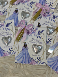 Invitations for a henna party with decorative elements on a textured surface