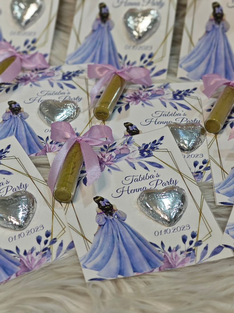 Decorative cards with silver heart-shaped favors and a purple ribbon, featuring an illustration of a woman in a blue dress.