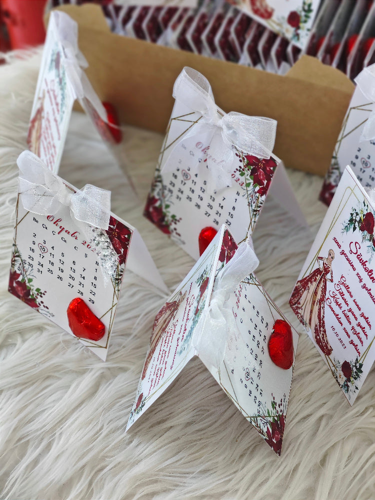 Decorative paper stars with floral designs and text on a textured surface