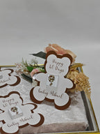 Baby shower invitation with teddy bear design and text on a decorative card.