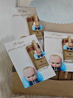 Set of cards with a baby illustration and text on a textured surface