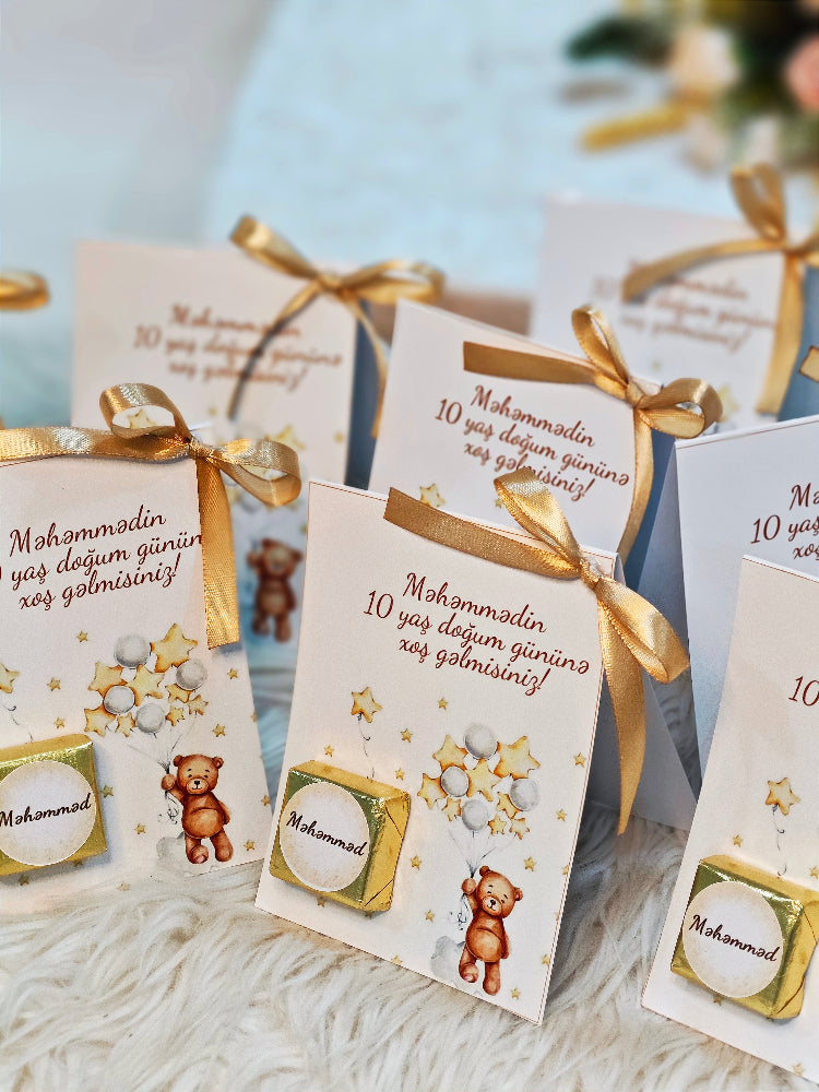Decorative cards with gold ribbons on a light background
