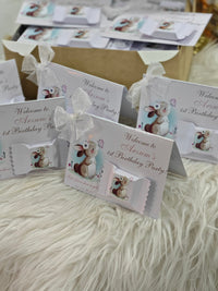 Set of birthday party invitations with animal illustrations on a textured surface