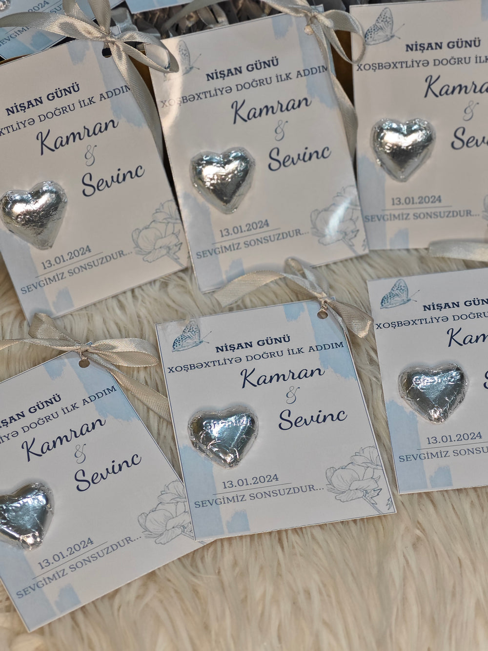 Silver Engagement Chocolate Card with “First Step to Happiness” Message and Light Blue Ribbon