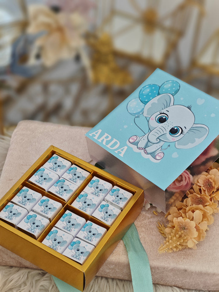 Box of cookies with a blue and white design on a beige surface with a blurred background