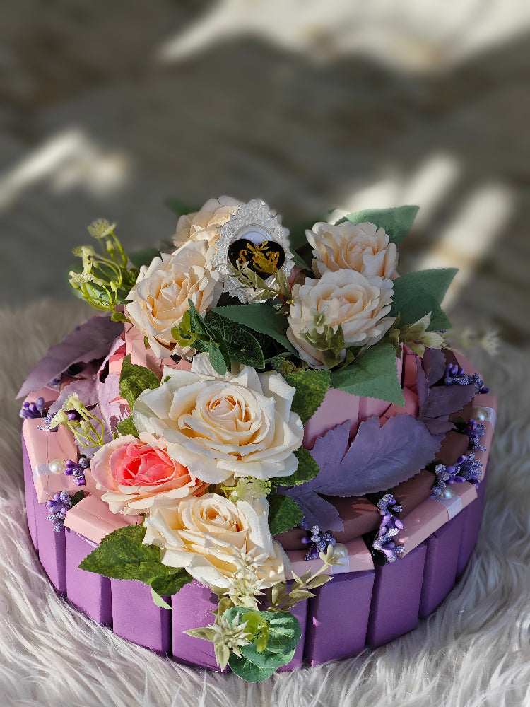 Decorative cake with flowers on a textured surface