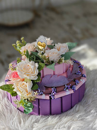 Decorative cake with flowers on a textured surface