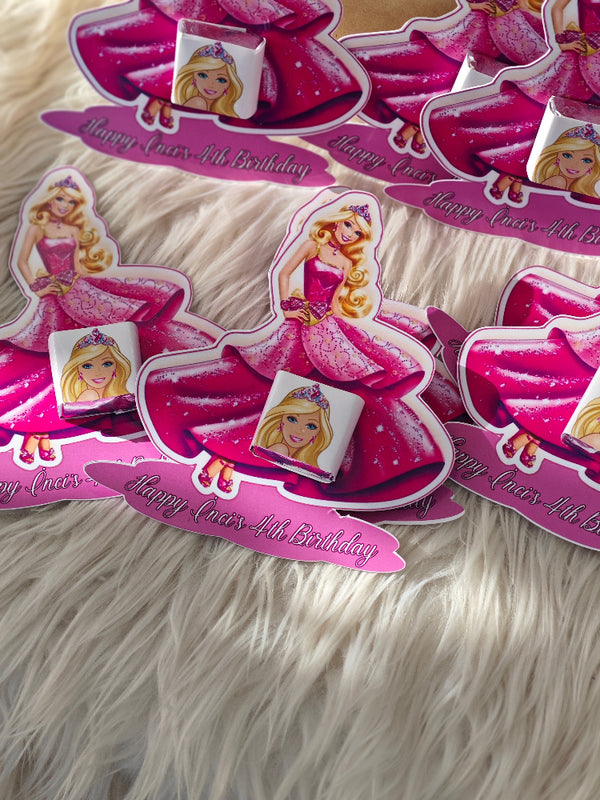 Set of personalized birthday cards with a princess design on a fluffy white surface.