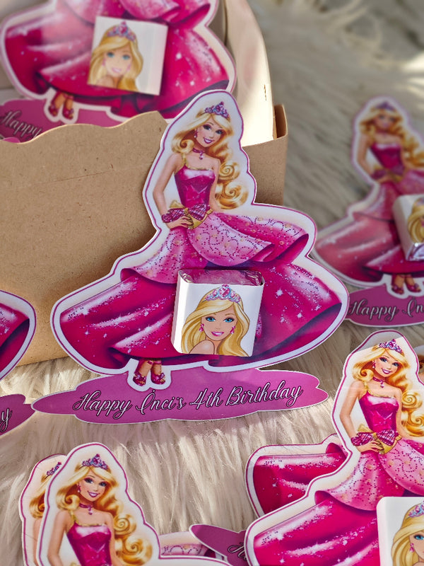 Barbie-themed birthday card with pink dress and 'Happy 4th Birthday' text on a cardboard backing.