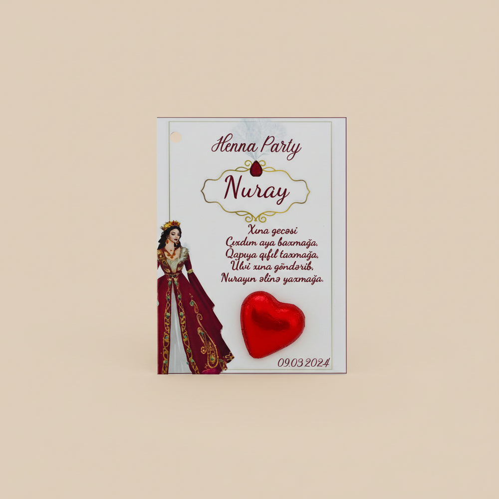 Henna party invitations with red ribbons and heart designs on a textured surface.