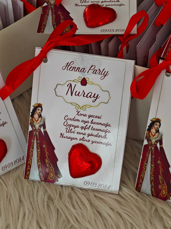 Henna Party invitation card with red heart and decorative elements on a textured surface