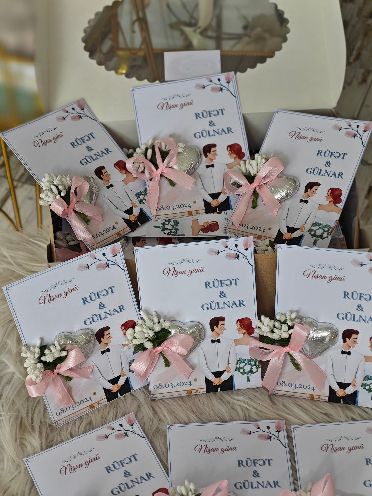 Collection of wedding invitations with decorative elements on a wooden surface.