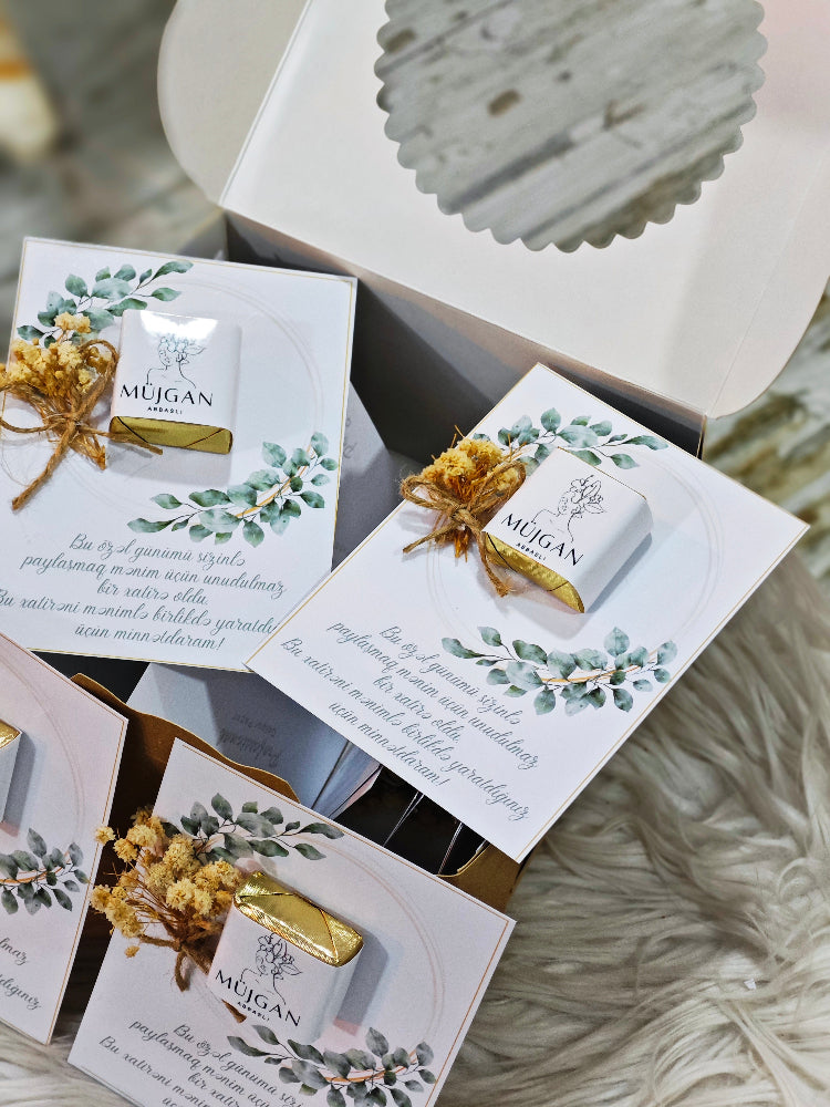 Mugan soap bars with decorative packaging on a textured surface