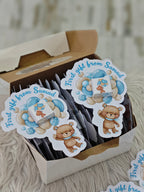 Stickers with teddy bear design and text 'First gift from Samad' in a box.