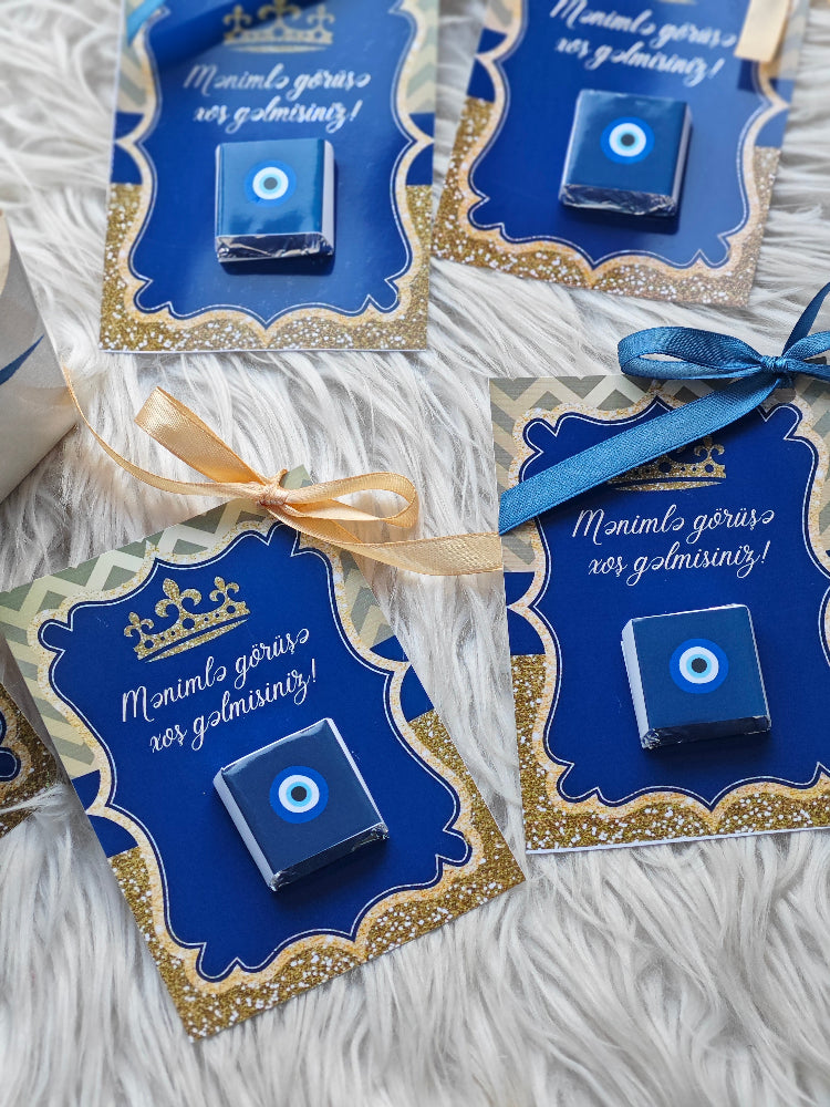 Blue decorative items with gold accents on white fabric