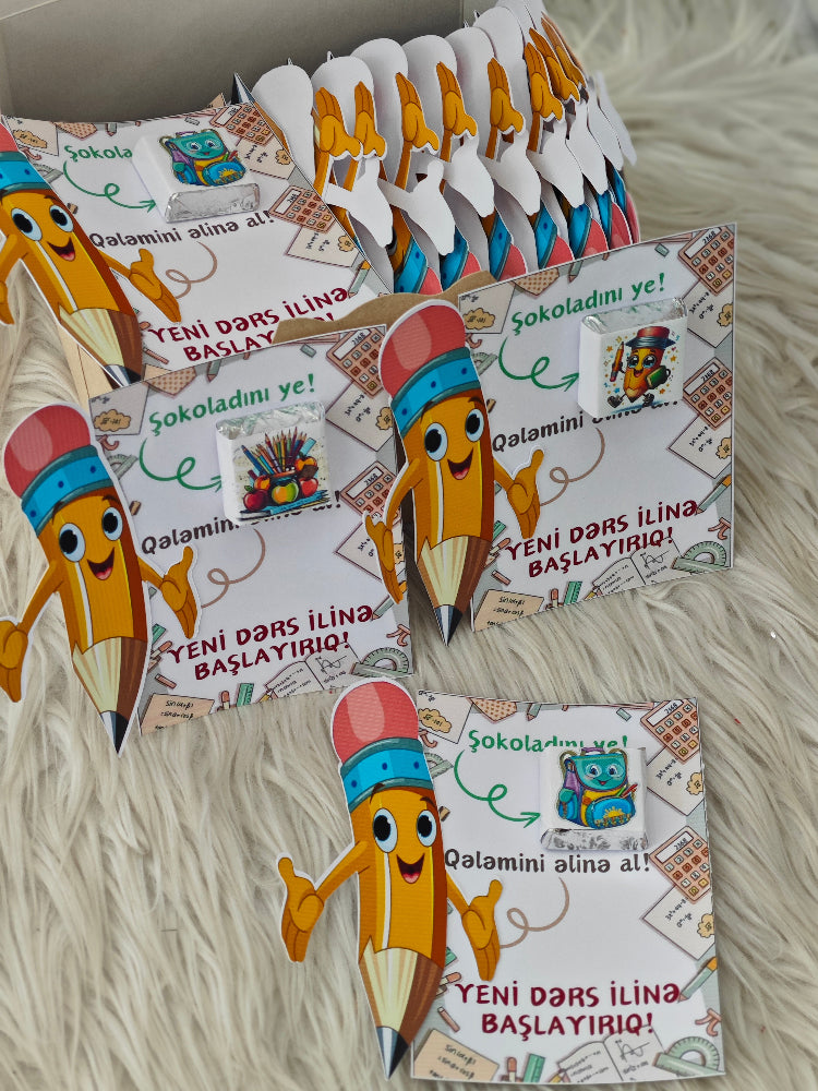 Set of colorful pencil-shaped cards with cartoon characters on a textured surface