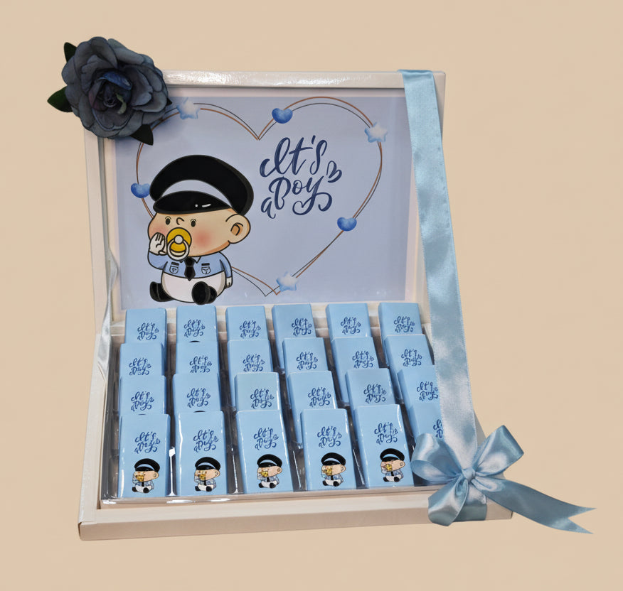 Gift set with cartoon character and 'It's a Boy' text, featuring small boxes and ribbons.