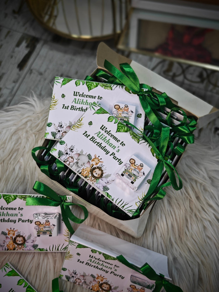 Set of birthday party invitations with green ribbons on a textured surface