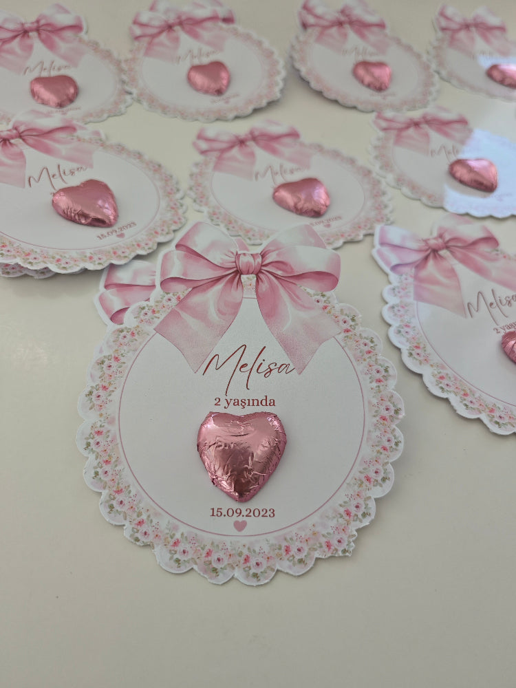 Decorative cards with pink hearts and ribbons on a light background