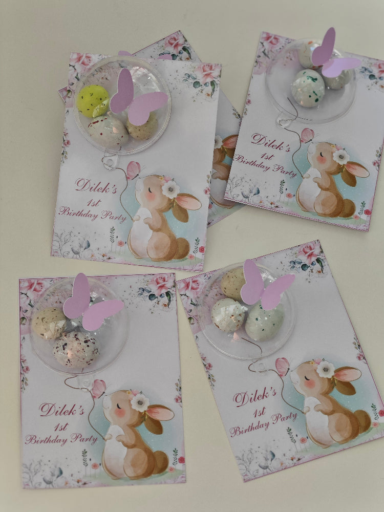 Four birthday invitations with bunny designs on a white background