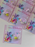 My Little Pony-themed birthday party favors with cards on a white background