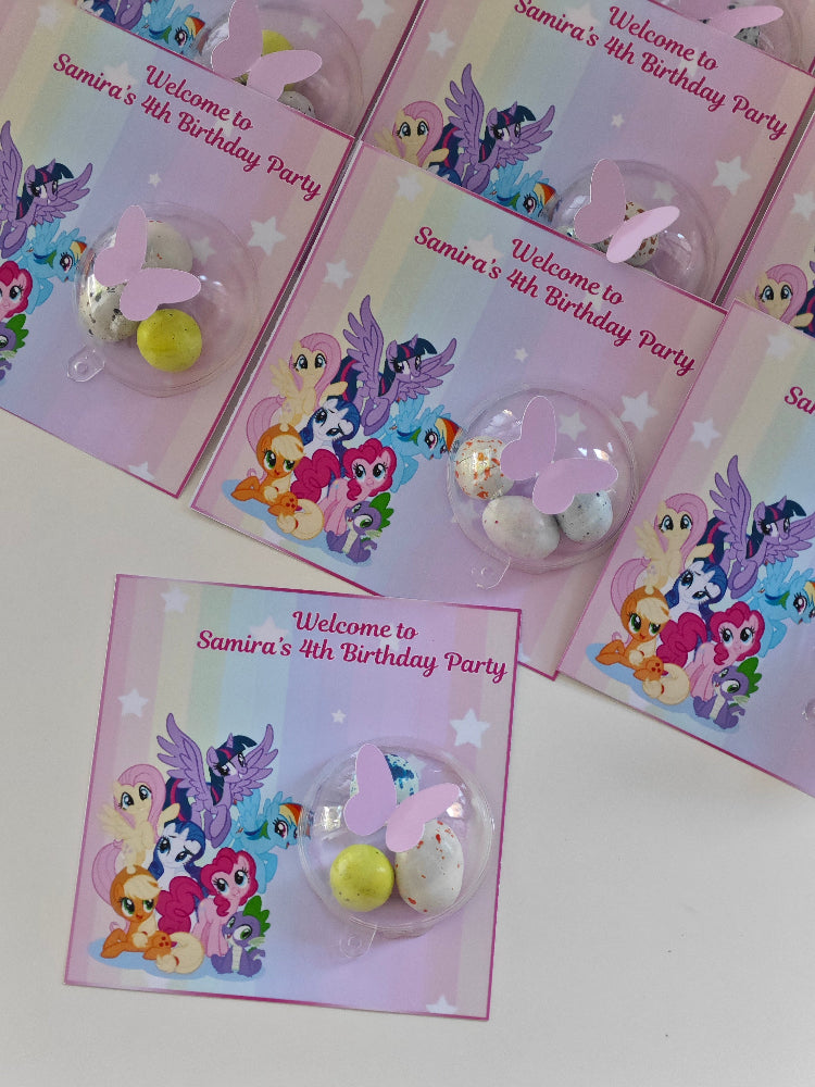 My Little Pony-themed birthday party favors with cards on a white background