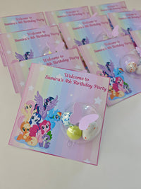Set of birthday party invitations with cartoon characters on a white surface