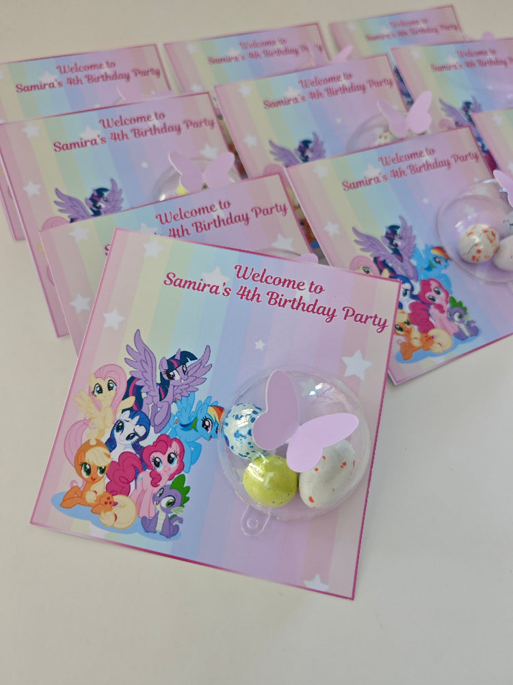 Set of birthday party invitations with cartoon characters on a white surface
