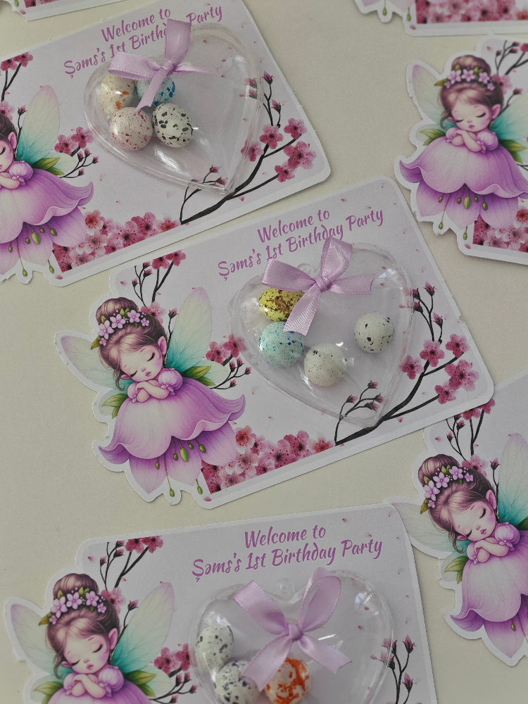 Decorative birthday party items with fairy design and 'Welcome to Son's 1st Birthday Party' text.
