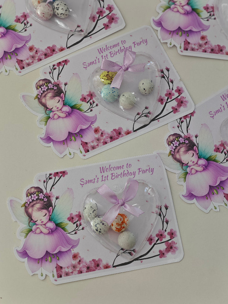Decorative birthday party cards with fairy illustrations and decorative elements on a light background.