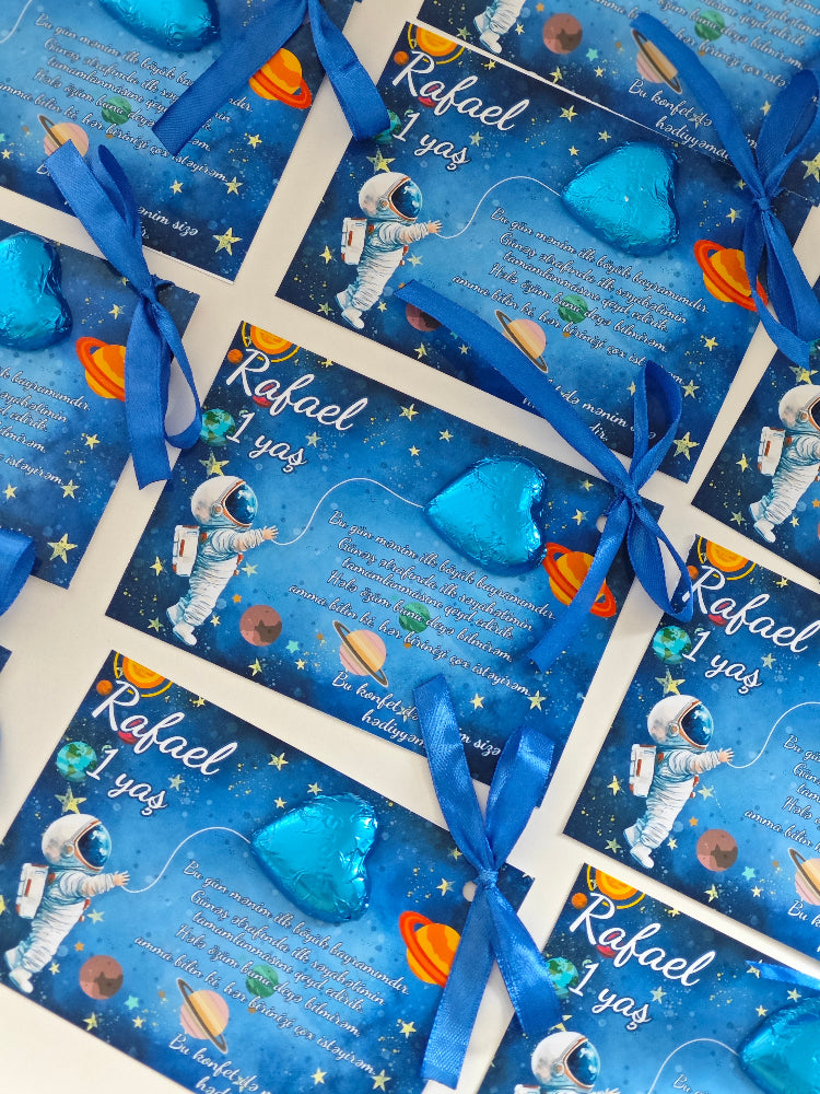 Space-themed birthday cards with blue ribbons on a white background