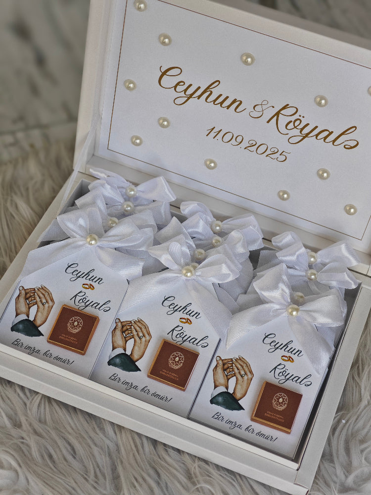 Gift box with personalized packaging featuring 'Ceyhan & Royals' and a date.