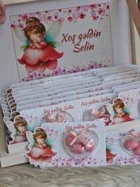 Set of cards with fairy design and text 'Xog goldin Selin' on a white surface.