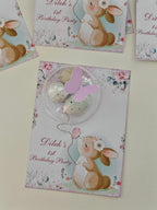 Children's birthday party invitations with bunny designs on a light background