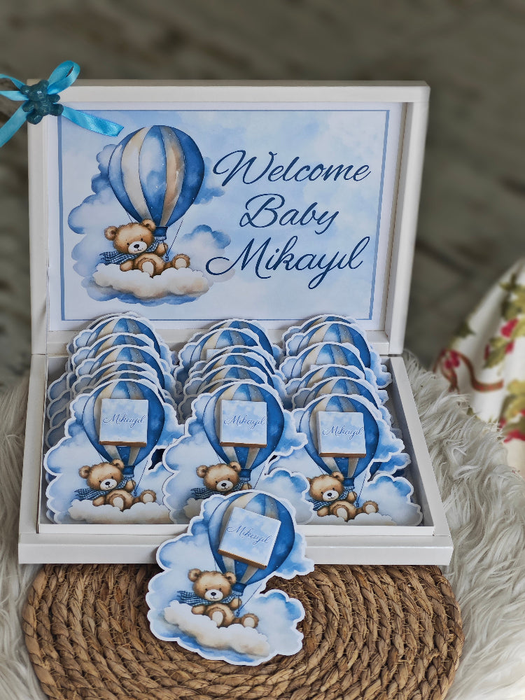 Baby shower invitation set with teddy bear and hot air balloon design, featuring 'Welcome Baby Mikayl'.