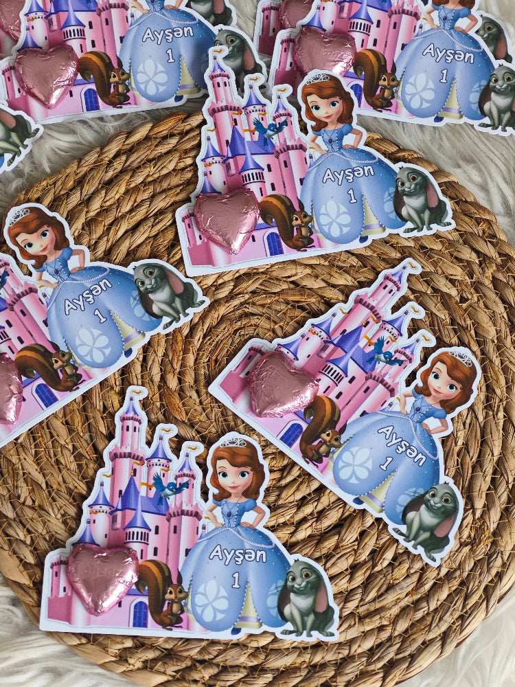 Stickers featuring a princess, castle, and heart on a woven surface