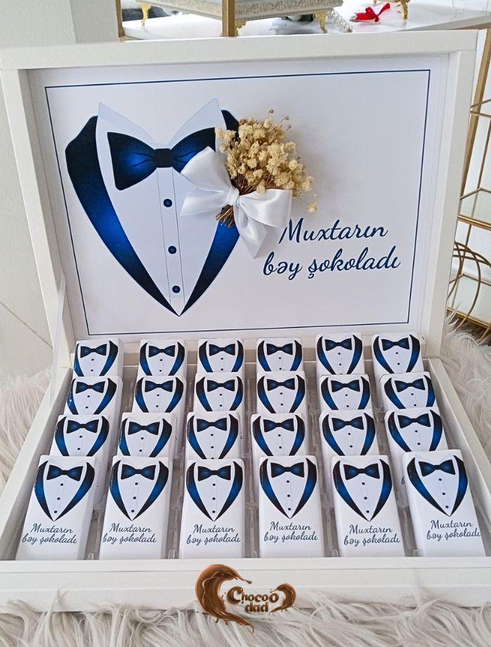 Present the groom with a luxurious 24-piece chocolate gift box, specially crafted for his big day! 🍫✨ Customized with the groom’s name, this elegant chocolate set is perfect for engagements, weddings, or special celebrations. 🎁🤵 A sophisticated gift that combines sweetness and style to honor the groom’s special moment. 🌟