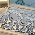 Welcome your little one in style with our 30-piece chocolate cards box featuring an adorable koala design