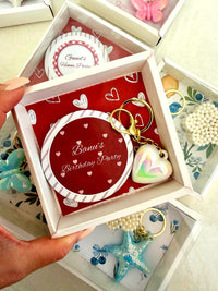 Mixed Accessory Birthday Favor Boxes Five Keychains and a Mirror — Chocoodad Baku