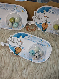 Decorative plates with stork and baby design, featuring text 'It's 40 Days'.