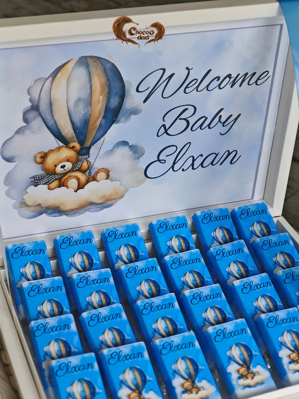 Baby shower gift with teddy bear and hot air balloon design, featuring the text 'Welcome Baby Elxan'.